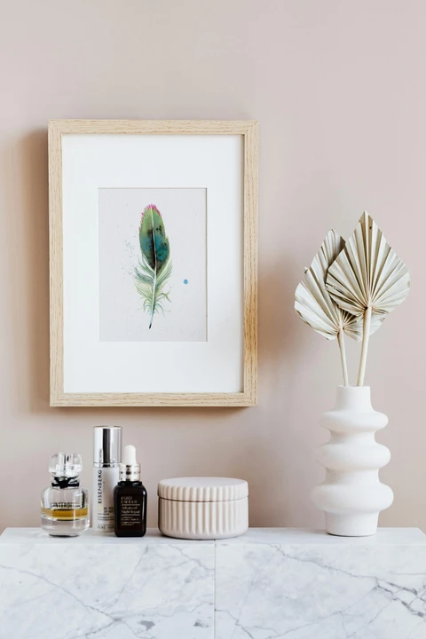 Image of a feather watercolor painting by Shayna Larsen, originals & prints available