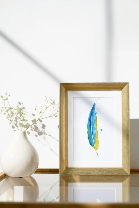 Image of a feather watercolor painting by Shayna Larsen, originals & prints available