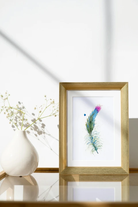 Image of a feather watercolor painting by Shayna Larsen, originals & prints available