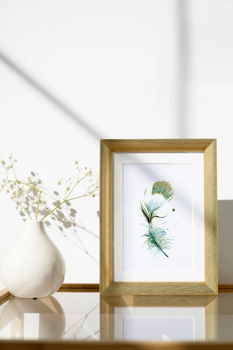 Image of a feather watercolor painting by Shayna Larsen, originals & prints available