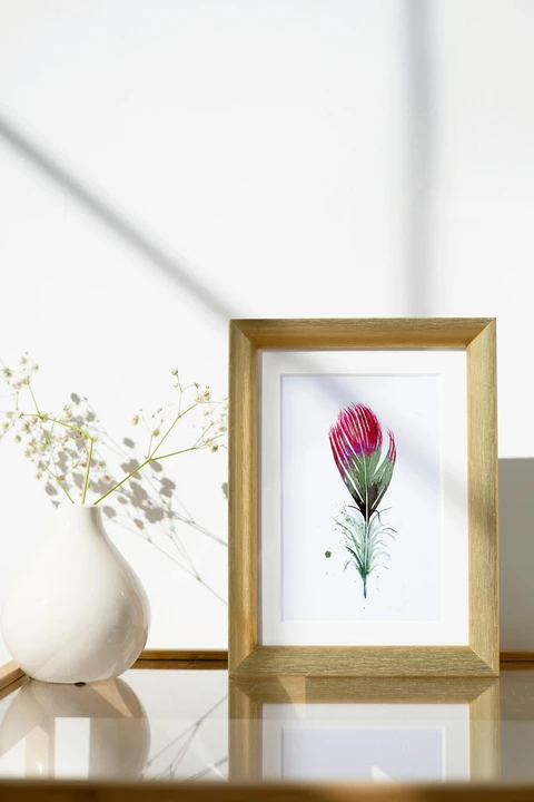 Image of a feather watercolor painting by Shayna Larsen, originals & prints available