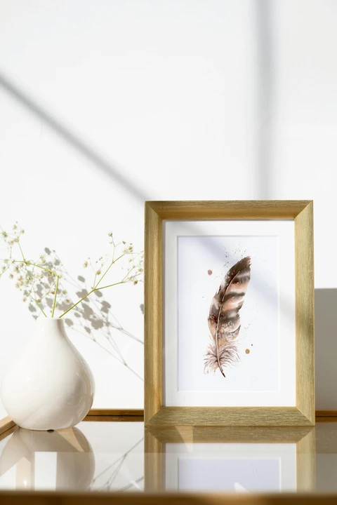 Image of a feather watercolor painting by Shayna Larsen, originals & prints available