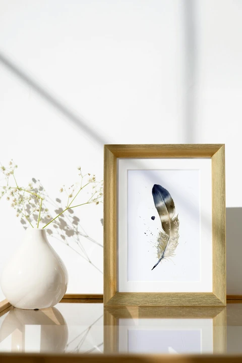 Image of a feather watercolor painting by Shayna Larsen, originals & prints available